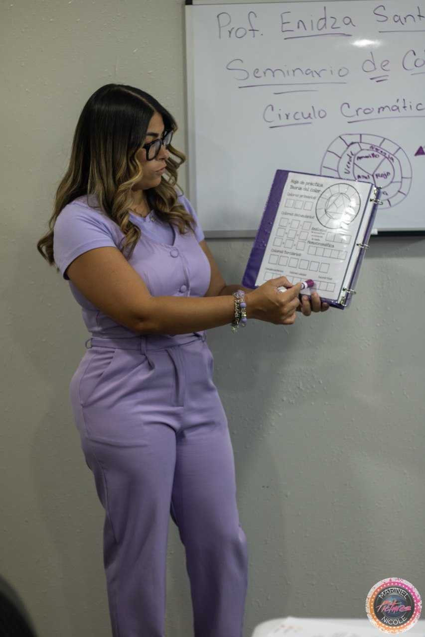Cosmetology instructor teaching the color wheel