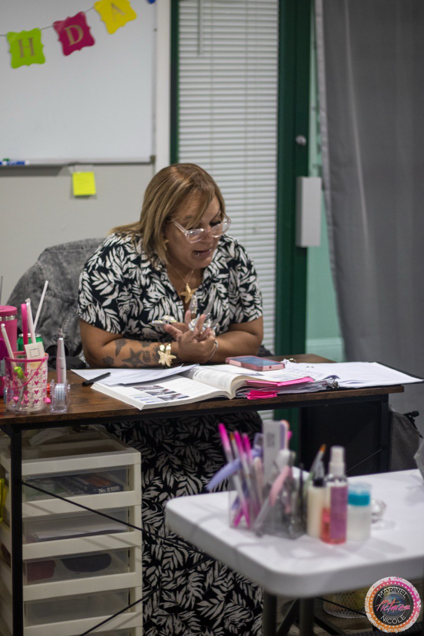 Nail technology instructor teaching from the professional curriculum